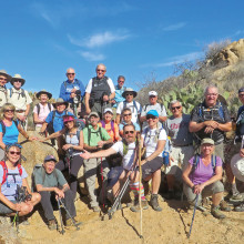 PebbleCreek “C” Hikers pause for lunch on the Government Springs segment of the Black Canyon Trail; photographer Lynn Warren.