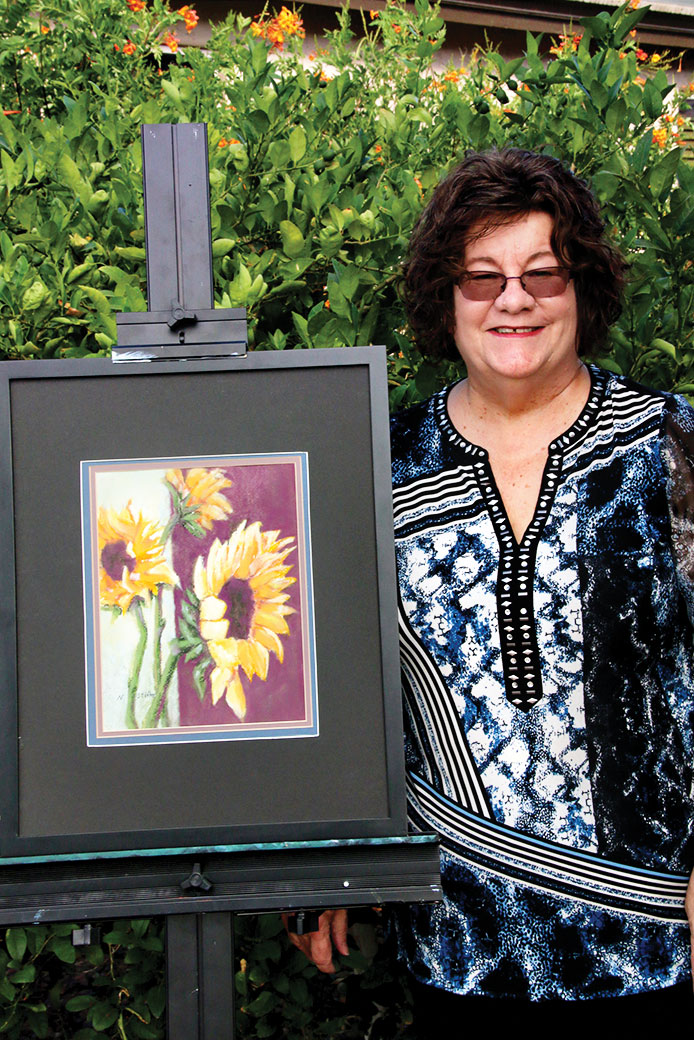 Nancy Stifter with Sherri’s Sunflowers