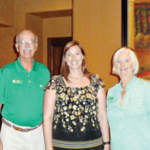 John and Carmel Flynn, the HHBD coordinators, present a check for $1,600 to Leanne Leonard, the executive director of the Agua Fria Food and Clothing Bank.
