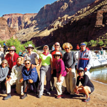 Left to right, front: Susan Rudoy, Jan Sherwood, Alex Elijew, Atsuko Arner and Beverly Kim; rear: Jim Cashman (guest), John and Susanne Vander Heyden, Charlene Elijew, Clete Lipetzky, Art Arner and Lynn Warren pause for a group photo before leaving Football Field campsite (Mile 137) on Day six.