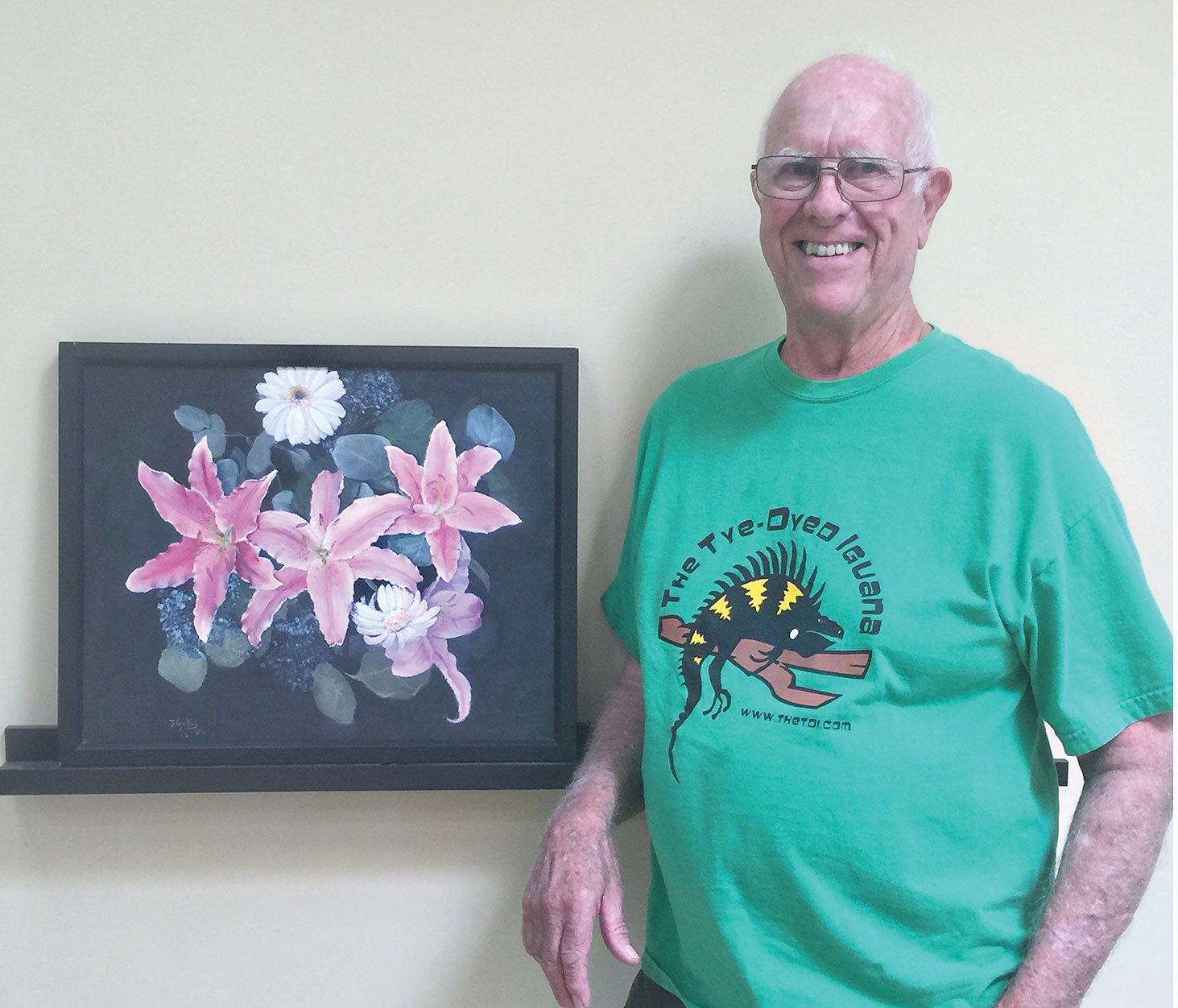 Tom Gallob displays his acrylic painting Oriental Lily.