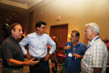 Speaker Mark Spencer, second from left, answering questions from members following the meeting