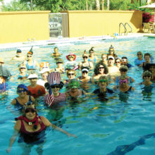 The Water Fitness class celebrated Halloween by dressing in waterproof masks and hats.