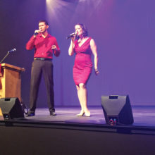 TAD Management performers Jessie and Laura Berger sing a duet.