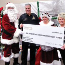 Left to right: Santa Claus, Chief Jerry Geier, Mrs. Claus and Wally Campbell, Chairman of PebbleCreek Home Tour Committee