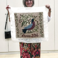 Sheila Millendorf proudly displays her first project.
