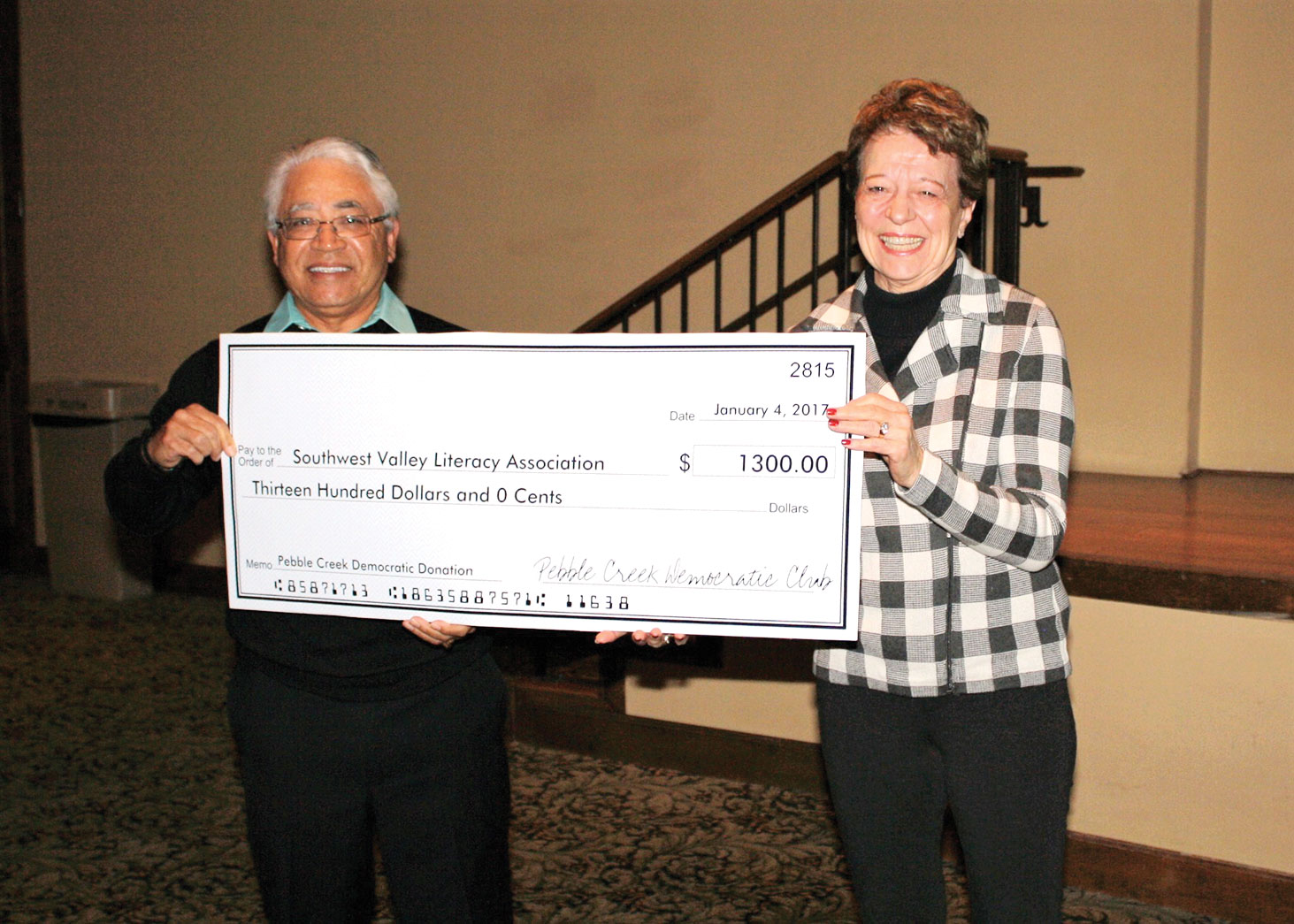 Bart Alford awards check to Jan Cosgrove of SWVLA