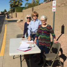 Left to right: Arlis Legler, the chair for distribution of the PebbleCreek Source Books, is pictured with volunteers Sherry Atwater and Laura Measles as they distribute Source Books to delivery volunteers.
