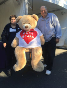 Tom and Maryann Bose, volunteers for Kare Bears, are pictured with the Kare Bears’ Bear at the DesertFest held in February.