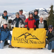 Eight PebbleCreek members of Valley of the Sun Ski Club (VSSC) on the slopes in Telluride, Colorado, left to right: Ted McGovern, Dave Geurden, Carol and Jim Jarvis, Sheryl Henke, David Shenton, Rose and Lew Geller pausing for a photo op on the slopes of Telluride; photo by Richard Vangelisti.