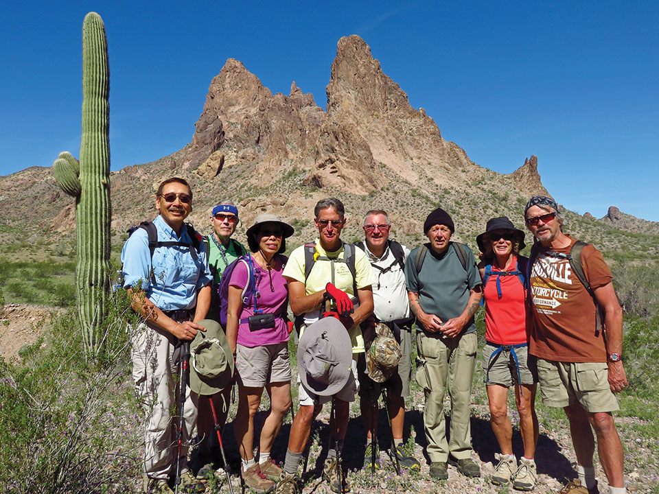 Left to right: Ed Kim, Lynn Warren (photographer), Beverly Kim, Mark Frumkin, Mark Gruca, Len Jeffery, Vicki Carter and Gary Bray pausing shortly after lunch with Eagletail Peak in the background.