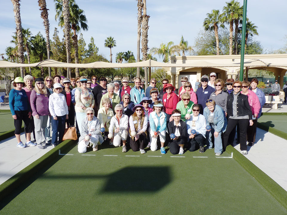 Participants in the March 4 Female Bocce Tournament gather at the Eagle’s Nest Courts to select teams by way of a blind draw.