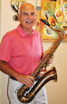Jeff Buda at his PebbleCreek home with his saxophone