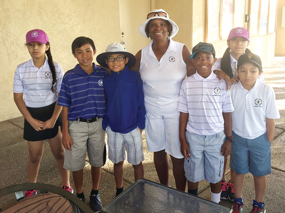 Carolyn Suttles pictured with Desert Mashie Juniors who participated in the weekend event. The Juniors monitored a Closest to the Pin Hole to raise monies for the Junior Golf Program.