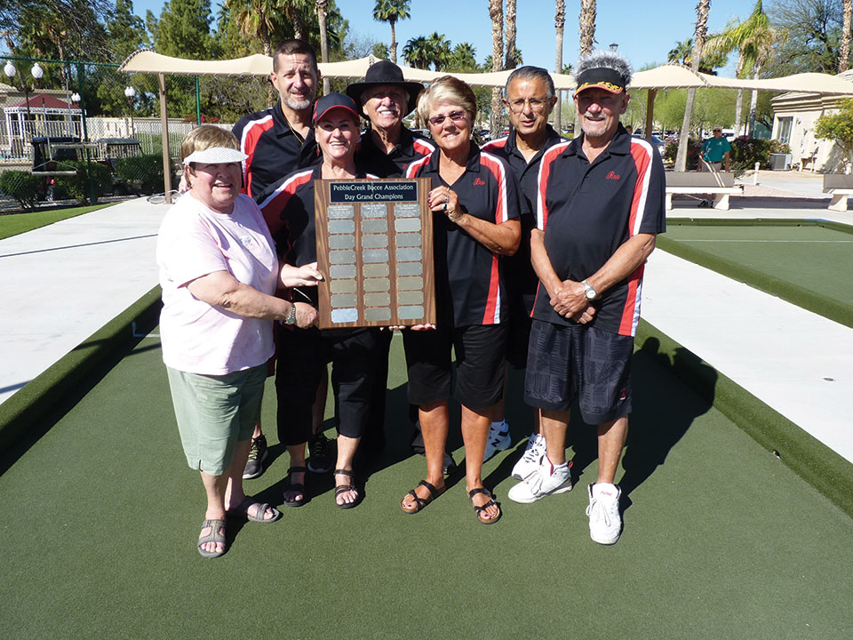 Statistician Carol Gwilt, left, presents trophy to winners of the Winter Day League Grand Championship team, Thunderbirds, left to right: Alex Potapoff, Ardys Smith, Lloyd Smith, Bev Loding, Richard Squillace and Ron Jacobs.