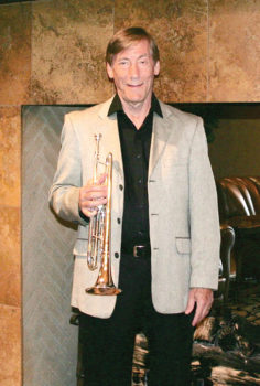 Bill Throssell with his trumpet at the Tuscany Falls Clubhouse