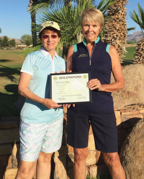 Carol Horan, the PCL9GA representative to the Arizona Women’s Golf Association, presents Arlene Greenberg with a hole-in-one certificate from the Association.