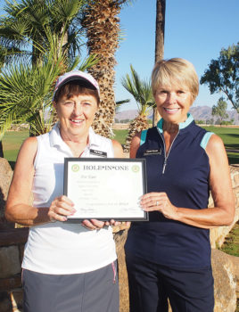 Carol Horan, the PCL9GA representative to the Arizona Women’s Golf Association, presents Pat Kaer with a Hole-in-One certificate from the Association.