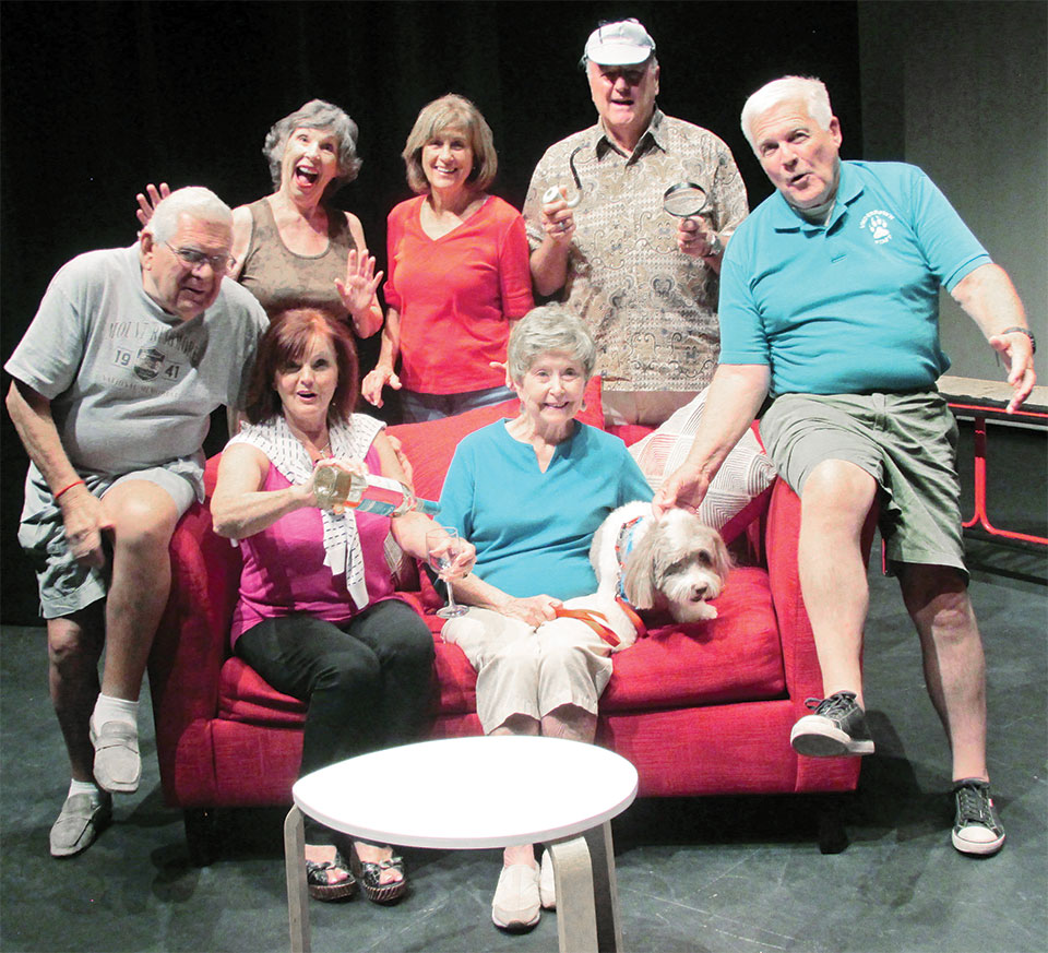 The Game’s Afoot cast members enjoying laughs before rehearsal, left to right standing: Laurie Overson, Donna Gray, Ray Haden; seated: John Gimon, Sophie Shrum, Shirley Robinson, Chip the dog and Jon Lindstrom. Missing from photo is Judi Blankenship.