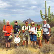 Left to right: Dana Thomas, Lynn Warren (photographer), Mark Frumkin, Pete Williams, Marilyn Reynolds and Clare Bangs along the Maricopa Trail under threatening skies with Red Mountain in the background.