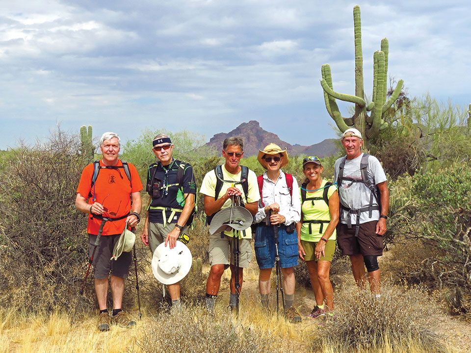 Left to right: Dana Thomas, Lynn Warren (photographer), Mark Frumkin, Pete Williams, Marilyn Reynolds and Clare Bangs along the Maricopa Trail under threatening skies with Red Mountain in the background.
