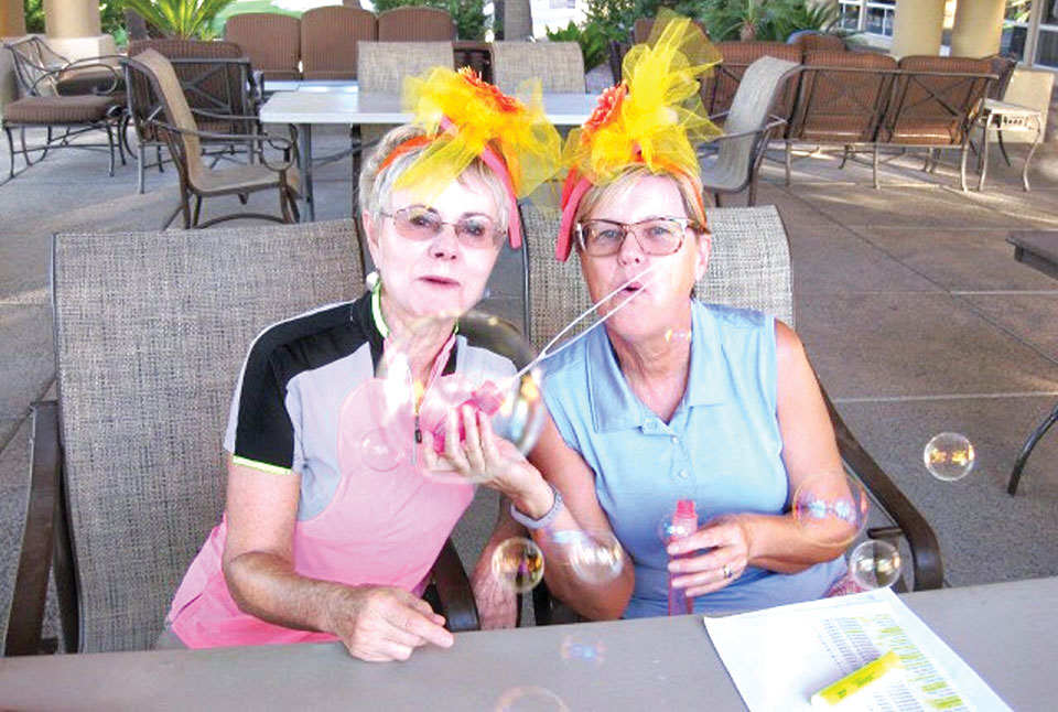 Tournament Chairs Cherrie Pierson and Vicki Ray blowing bubbles