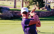 Madeline Laux takes a practice shot.