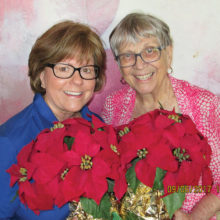 Poinsettia admirers Jan Stash and Barbara Kordel