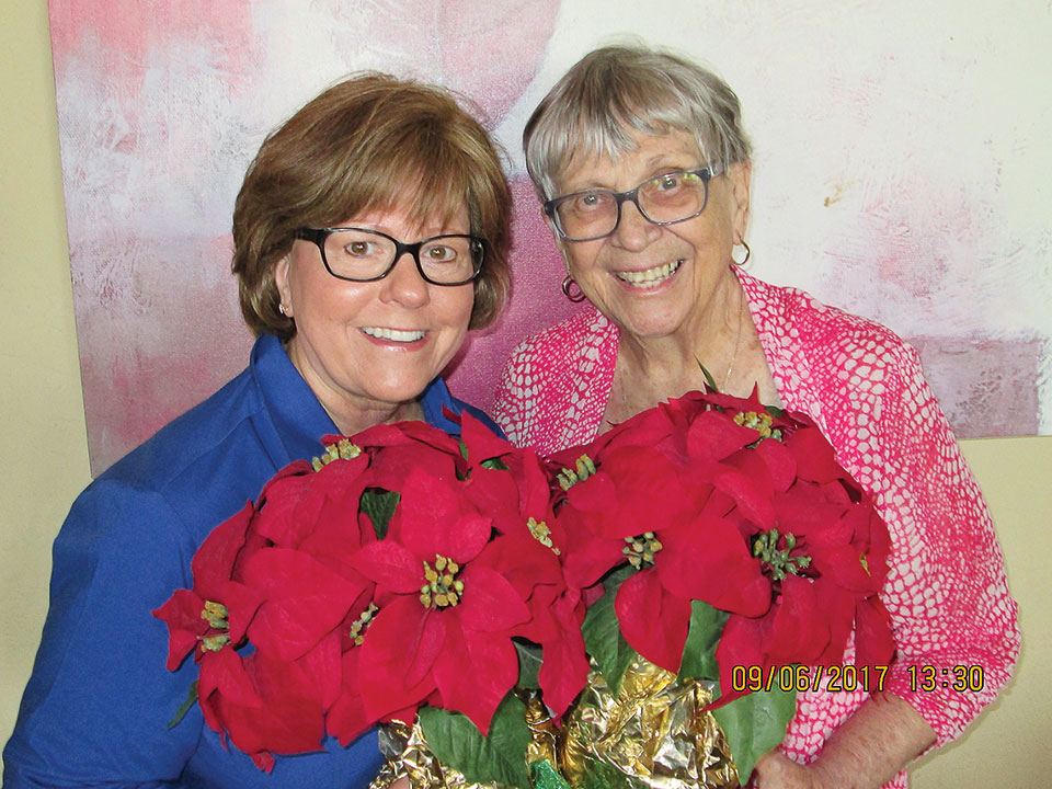 Poinsettia admirers Jan Stash and Barbara Kordel
