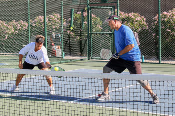 Andrea Dilger and Rick Watson concentrate on covering the middle of the court; Photo by Dannie Cortez.
