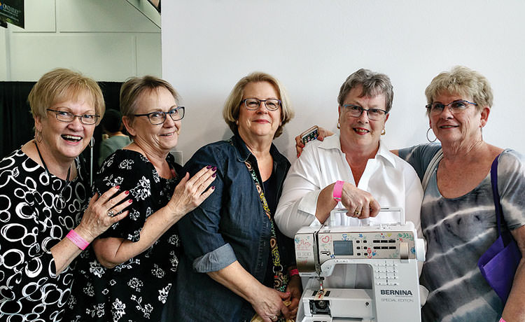 Exciting times for PC Quilters, Marlene Kuskie, Liz Gray, Chris Booth, Jean Fry and JoAnn Stansell as she received her prize.