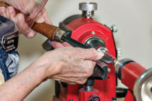 Figure 1: Jeannette McElroy working on the lathe.