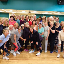 Eight in the morning — up and at ‘em Aerobics class at the Fitness Center with instructor, Ann Merrill (front row center).