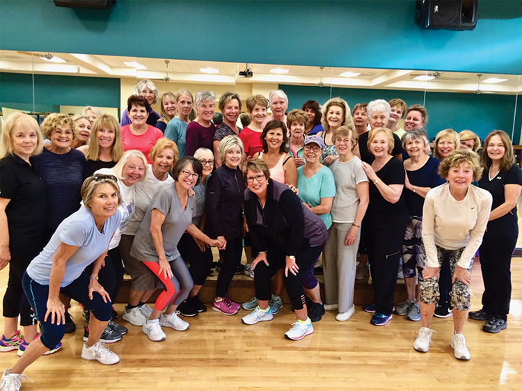 Eight in the morning — up and at ‘em Aerobics class at the Fitness Center with instructor, Ann Merrill (front row center).