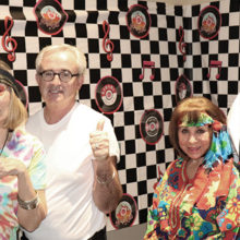 Judy and Ross Hart and Frankie and Chuck Veltri get in the ’60s spirit to help promote the upcoming Blast Back to the Past dinner, dance, musical extravaganza; Photo by Phil Korzilus.