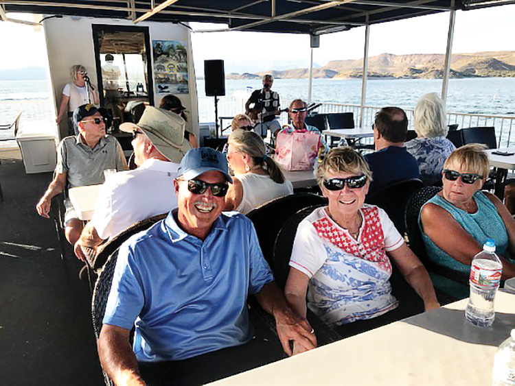 Rick and Sandy Haendel from unit 62B enjoy an evening on Lake Pleasant with their neighbors.