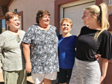 A job well done. PC Singles Club volunteers (left to right) Rita Erne, Kathy Weldon and Jane Bacon accept warm thanks from Community Development Director Devin DeFendis after completing the renovation of a casita at the New Life Center.