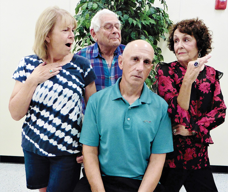 There is more than just food heating up in the PC Players comedy, The Kitchen Witches. The cast from left to right: Sue Tearpak, John Gimon, Mike Schwartz, and Judi Blankenship.