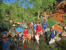 Left to right: Neal Wring, Pete Williams, Wayne McKinney, Mary Hill, Barb Schaepe, Marilyn Reynolds, Dave Ausman (“Ausy”), Lynn Warren (photographer), Clare Bangs, and Dennis Zigmunt pausing for a cool selfie in West Clear Creek.