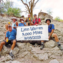 Celebrating the achievement were (left to right): Clare Bangs, Eileen Lords-Mosse, Pete Williams (hike leader), Neal Wring, Lynn Warren (photographer), and Wayne McKinney.