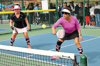 Becky Cox and Sonja Drinkwater control the net. Photo by Dannie Cortez.