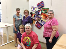 Some of the bags on display with Mary Hill, Maura Weddle, and Judy Frank (back); and Lynne Hupp and Cathy Howell (front). Thank you to all the faithful Community Sew Saturdays for making a difference in the lives of others.