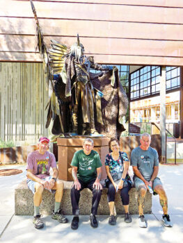 Left to right: Lynn Warren, Len Jeffery (London), Adriana Greisman, and Paddy Hoy paused at the Bear Tracks sculpture on an outing to the Scottsdale Museum of the West.