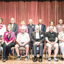 Twenty PebbleCreek veterans were honored with special, hand-made red, white, and blue quilts stitched by the PebbleCreek Quilters Club; Photo by Sandy Horvath.