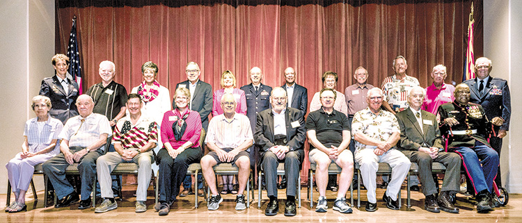 Twenty PebbleCreek veterans were honored with special, hand-made red, white, and blue quilts stitched by the PebbleCreek Quilters Club; Photo by Sandy Horvath.