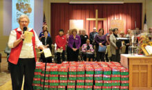 Edna DeFord and Shoe Box Committee dedicate a small portion of the shoe boxes packed by church family.