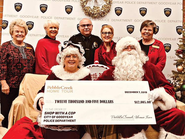 Back row (left to right): Wally Campbell; Suzanne Butler; Deputy Chief of Police Santiago “Jimmy” Rodriguez; Barbara Hockert, and Charlotte Krause; front row: Mrs. Claus and Santa