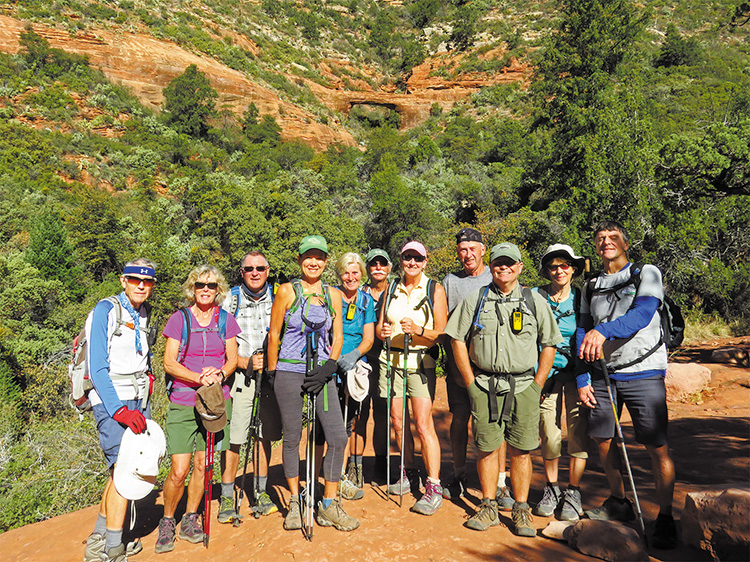Left to right: Lynn Warren (photographer), Vicki Carter, Mark Gruca, Kris Raczkiewicz, Eileen Lords-Mosse, Dave Ausman (“Ausy”), Julie Walmsley, Clare Bangs, Neal Wring, and Susan and Tom Bernt with Vultee Arch in the background.
