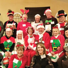 The Sunday Couples Golf Group celebrates by dressing up for a murder mystery. Back row: Angelo Fergione (VIP the Elf), Lloyd Chilton (Little Drummer Boy), Lee Kitchel (Rudy the Reindeer), Jerry White (Scrooge), Mike Dinan (Gingerbread Man), Al Carney (Icy the Snowman), Terry Johnson (Toymaker); Middle row: Liz Fergione (the Nutcracker), Barb Chilton (Dap the Elf), Virginia Kitchel (Polar Bear), Mary Barry (Mrs. Santa), John Barry (Santa), Kathy Carney (Pax the Elf), Sharon Johnson (Prisser the Reindeer); Front row: Sue White (Gab the Elf), and Jayne Dinan (Ozzy the Reindeer)