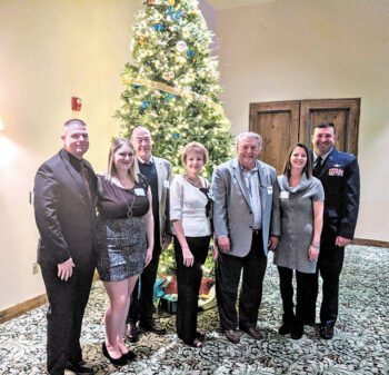 Luke Spouses’ Club honored at the PCM9GA holiday party. Left to right are Sergeant Major Dawson Bailey, Tarrin Bailey (LSC scholarship chair), John McCahan (PebbleCreek director of golf), JoAnne Clements, Ray Clements (president of the PCM9GA), Jessie Edwards (president, LSC), and Lieutenant Colonel Nate Edwards.